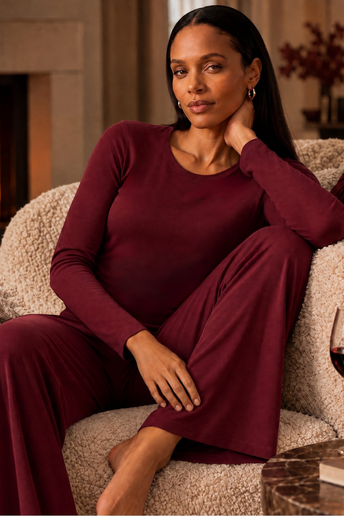 woman lounging in camofleur bordeaux red loungeset