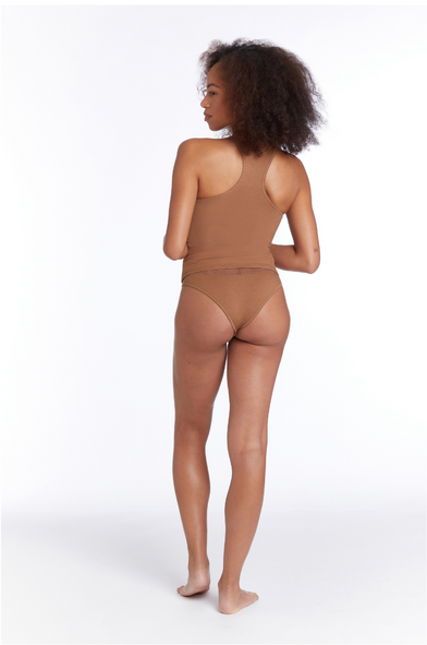 woman in cedar brown racerback tank and cheekini from camofleur made of bamboo-cotton. Ultra-soft with built-in pantyliner.