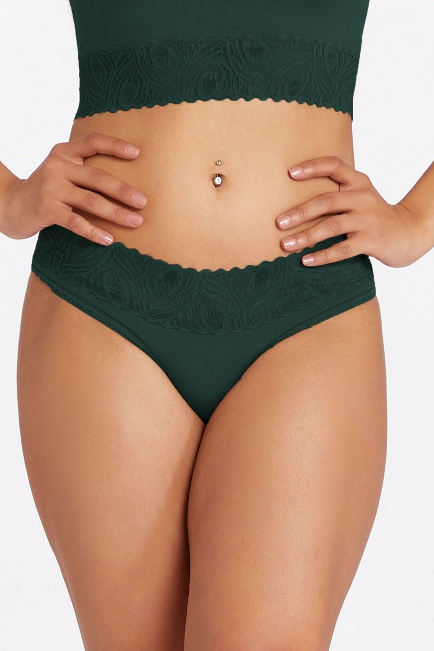 model wearing a forest green cheekini from Camofleur. Made with sustainable bamboo-cotton for comfort and health.