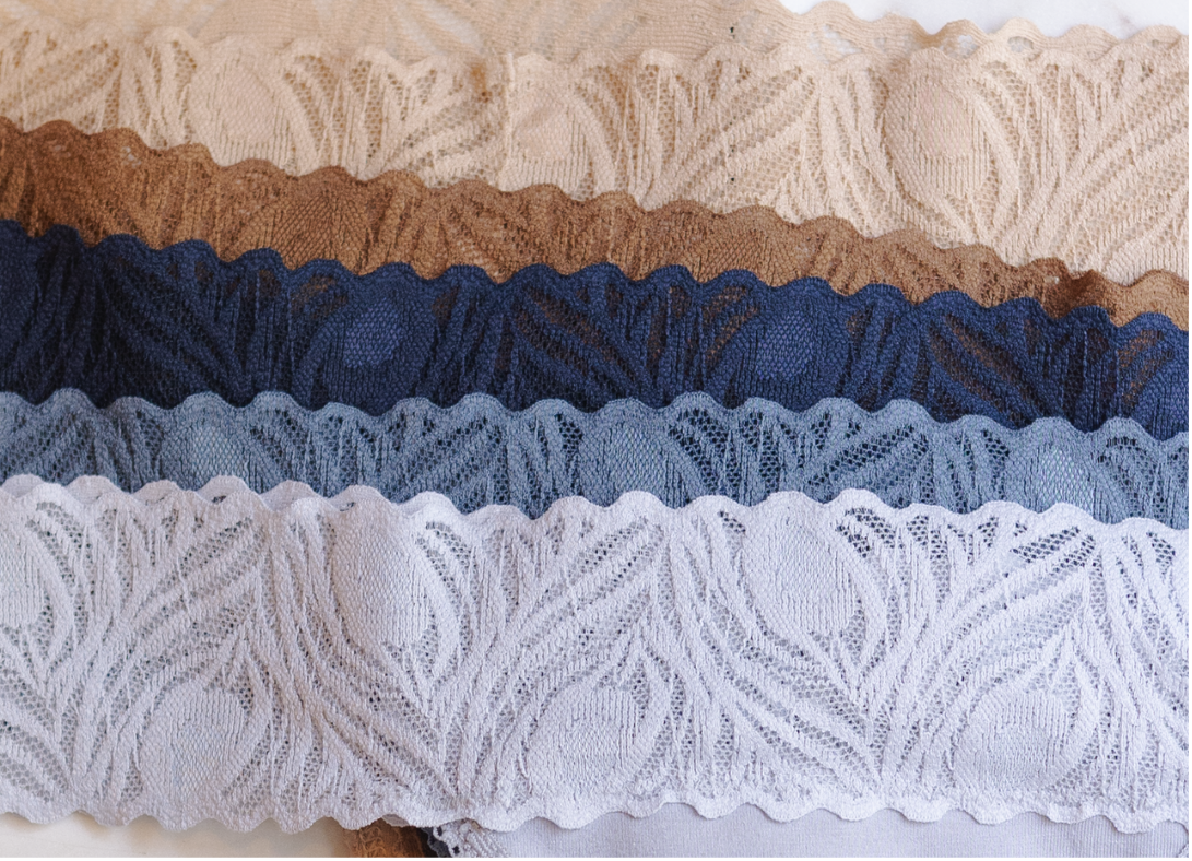 Collection of lace trims in beige, brown, blue, and white.
